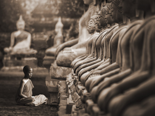 Pangea Images, Young Buddhist Monk praying, Thailand (sepia)