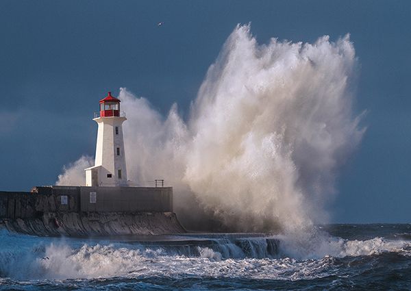 Pangea Images, Lighthouse in raging Sea